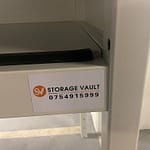 storage vault logo on over bonnet shelf