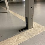 fixing legs of over bonnet storage to parking space floor