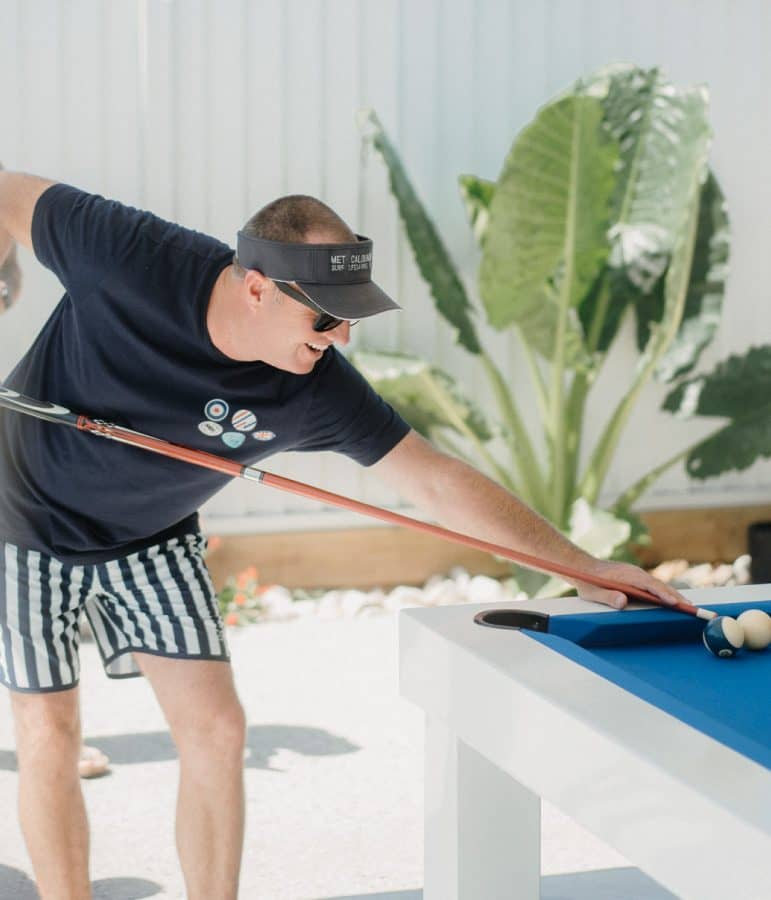 Playing pool on an outdoor table from  the Billiard Shop
